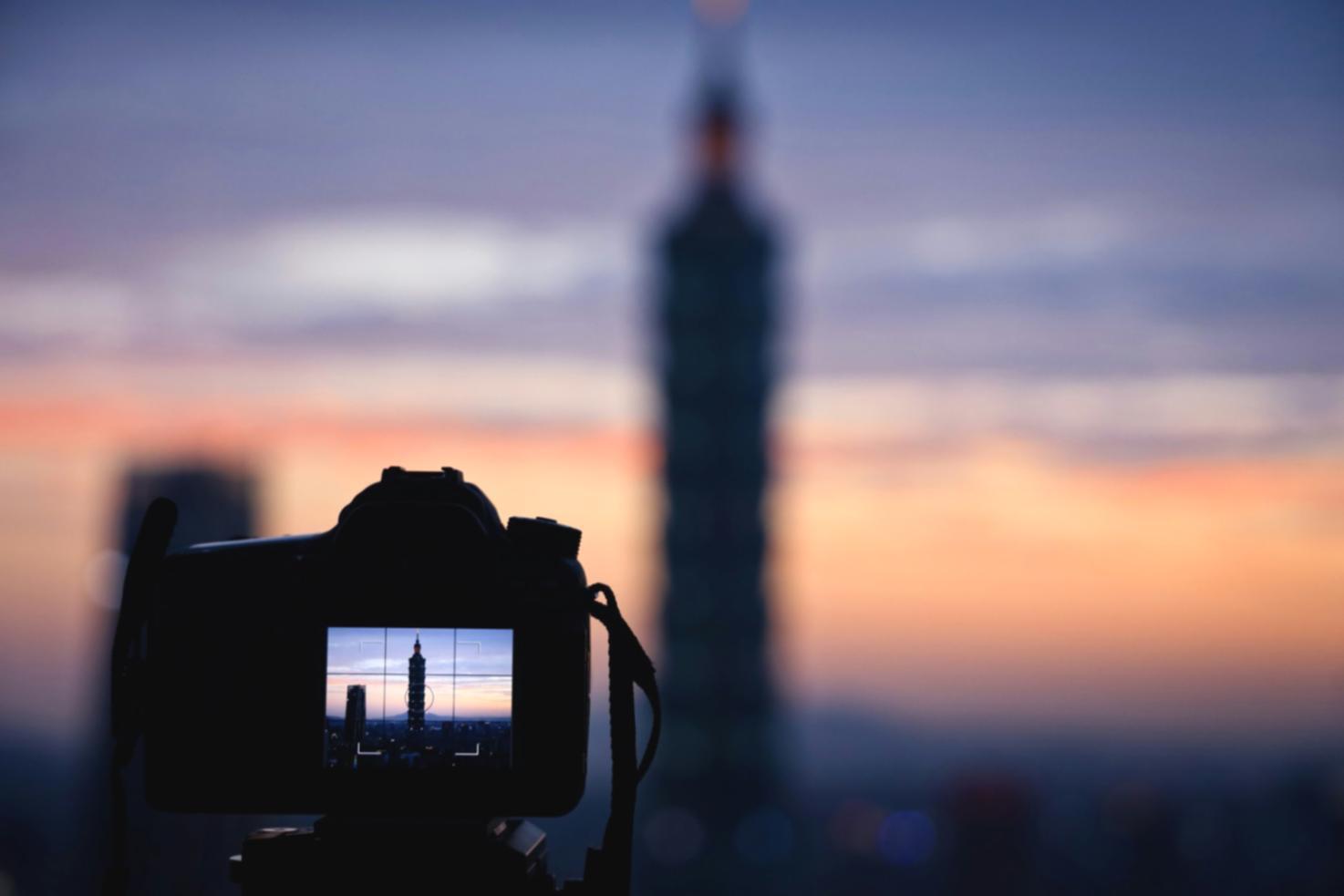 Professional video editing workspace setup with multiple monitors displaying timeline and preview windows
